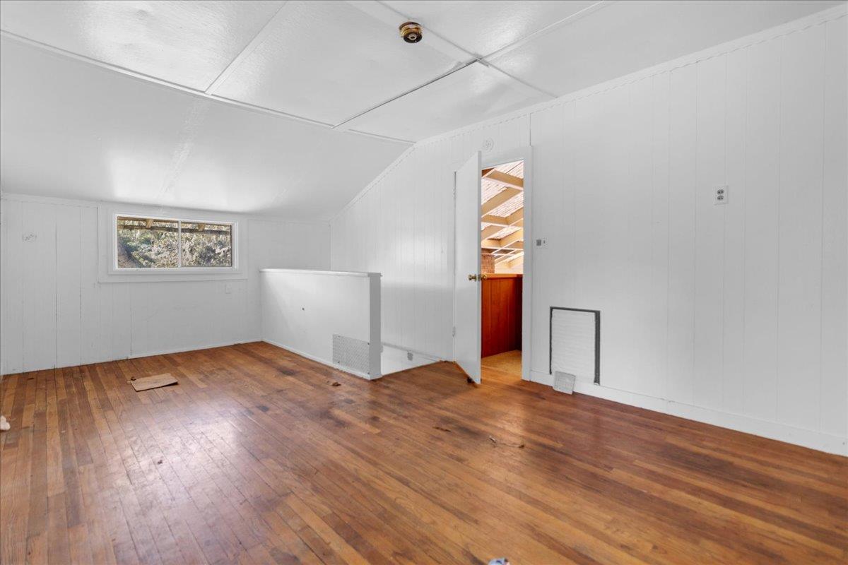 379 Corral De Tierra Road Salinas, CA 93908 - Photo 27 of 47 a view of an empty room with wooden floor and a window