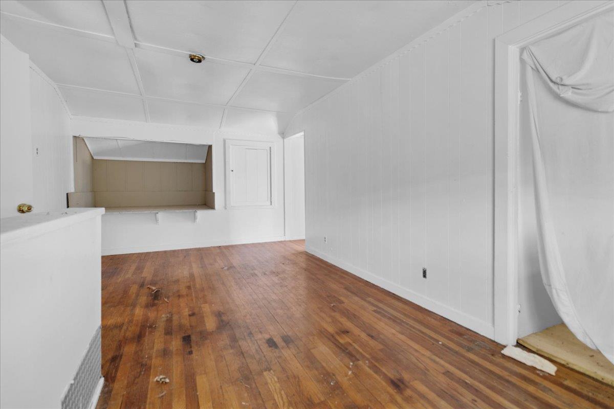 379 Corral De Tierra Road Salinas, CA 93908 - Photo 28 of 47 a view of an empty room with wooden floor and a window