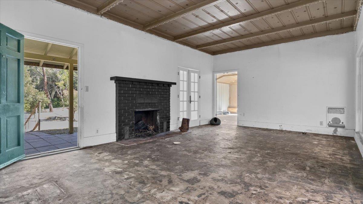 379 Corral De Tierra Road Salinas, CA 93908 - Photo 7 of 47 a view of an empty room with a fireplace and a window