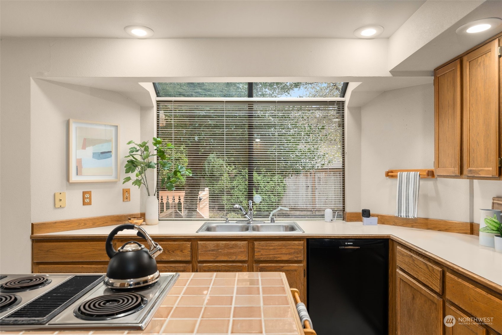 15518 Southeast 183rd Drive Renton, WA 98058 - Photo 13 of 35 a kitchen with a large window and a sink