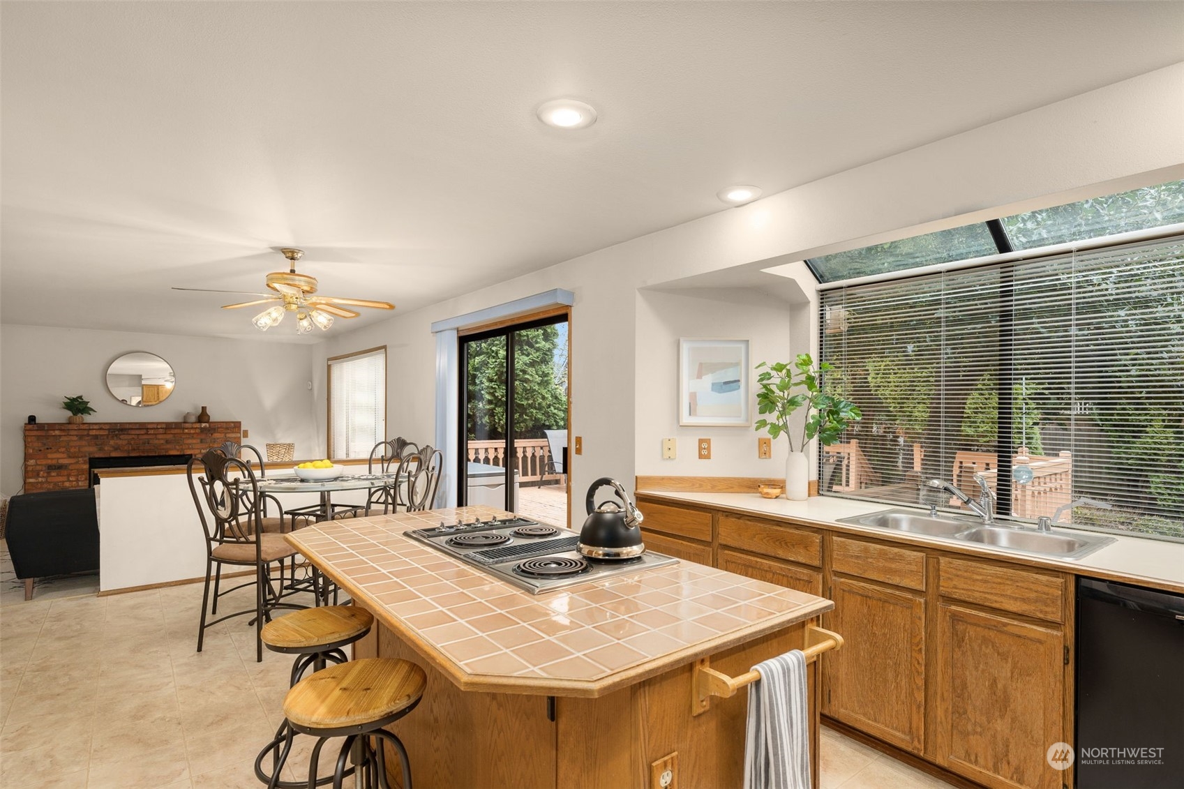 15518 Southeast 183rd Drive Renton, WA 98058 - Photo 15 of 35 a kitchen with a table chairs sink and cabinets