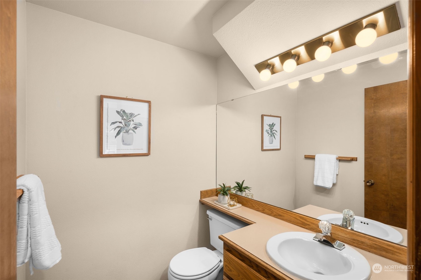 15518 Southeast 183rd Drive Renton, WA 98058 - Photo 19 of 35 a bathroom with a sink mirror vanity and toilet