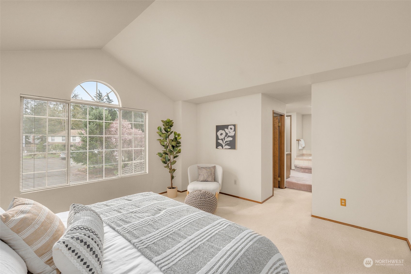 15518 Southeast 183rd Drive Renton, WA 98058 - Photo 21 of 35 a bedroom with a large bed and a large window