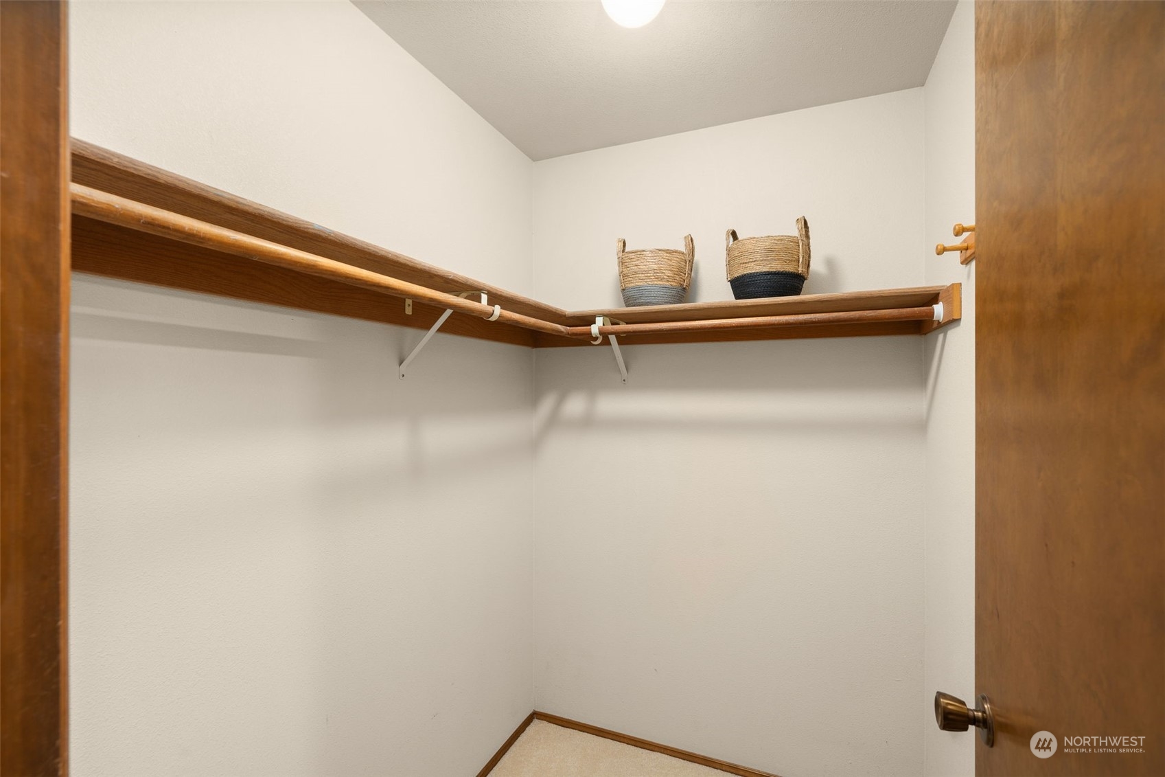 15518 Southeast 183rd Drive Renton, WA 98058 - Photo 25 of 35 a view of a closet with wooden floor
