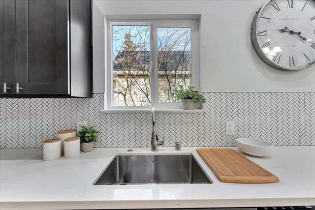 a view of a sink and a window