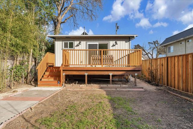 a view of house with a roof deck
