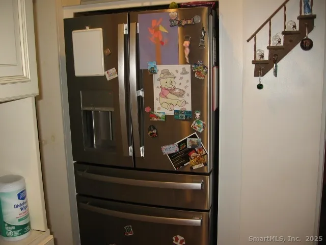 a living room with furniture a rug and a table