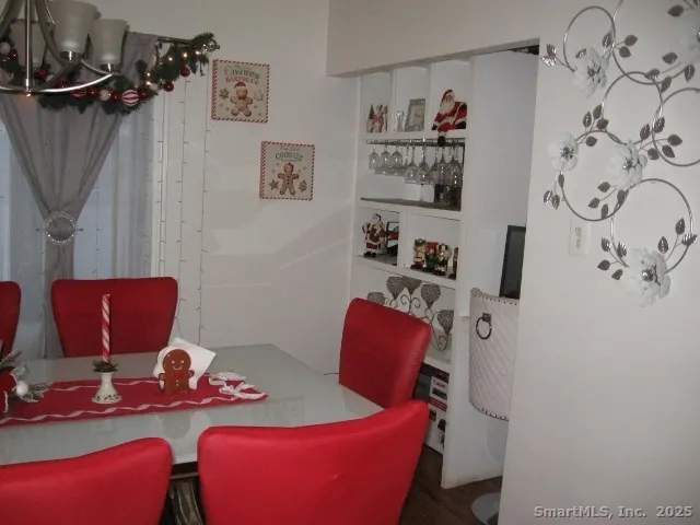 a bathroom with a sink and mirror with toilet