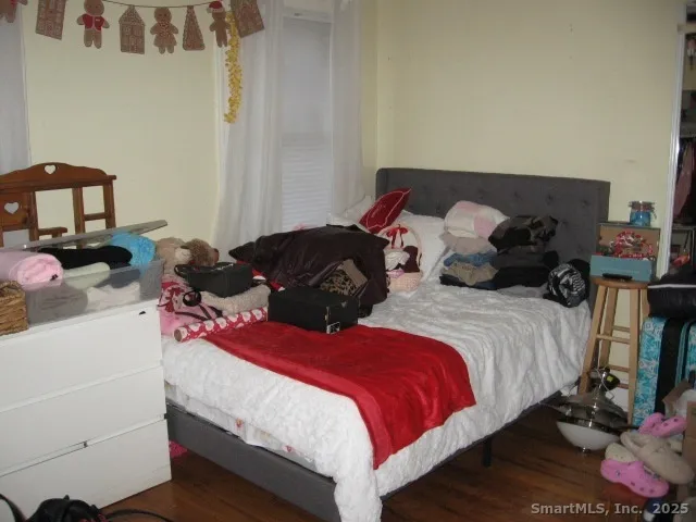 a living room with furniture and a bed