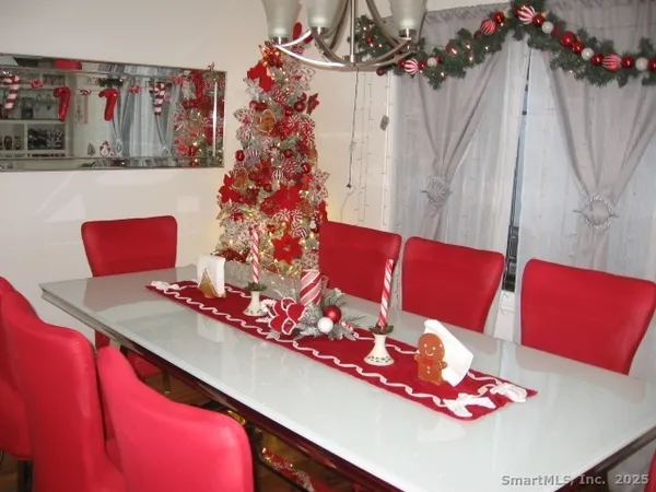 a living room with furniture and a bed