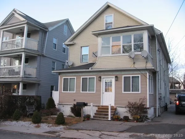 a front view of a house with yard