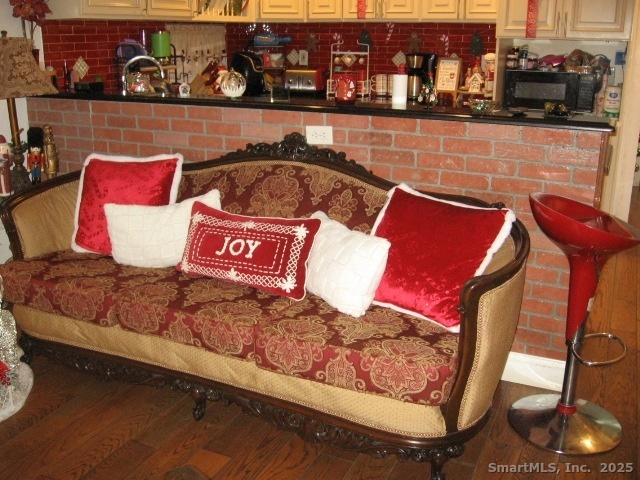 105 Edin Avenue Waterbury, CT 06706 - Photo 9 of 27 a view of a couch sitting in a kitchen
