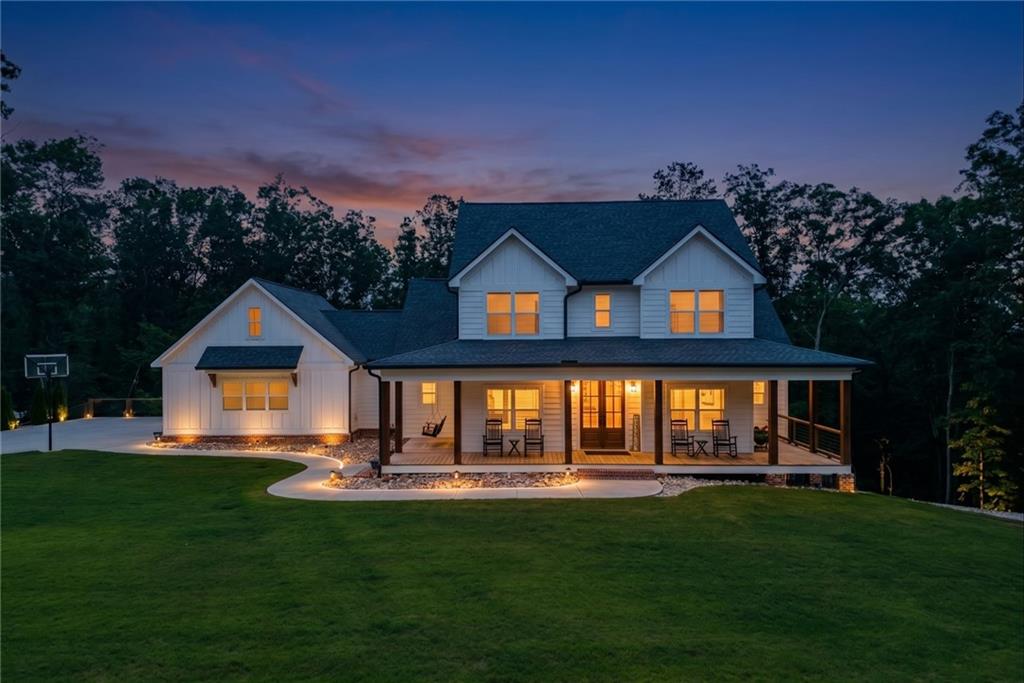 2250 Sperin Road Ball Ground, GA 30107 - Photo 3 of 56 a front view of a house with yard and green space