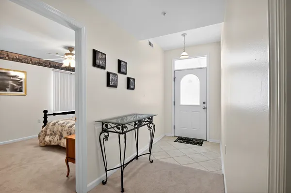 a view of a livingroom with furniture and windows