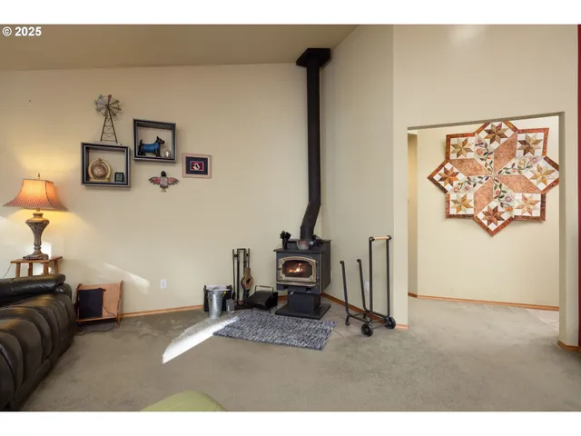 a bedroom with furniture and a mirror