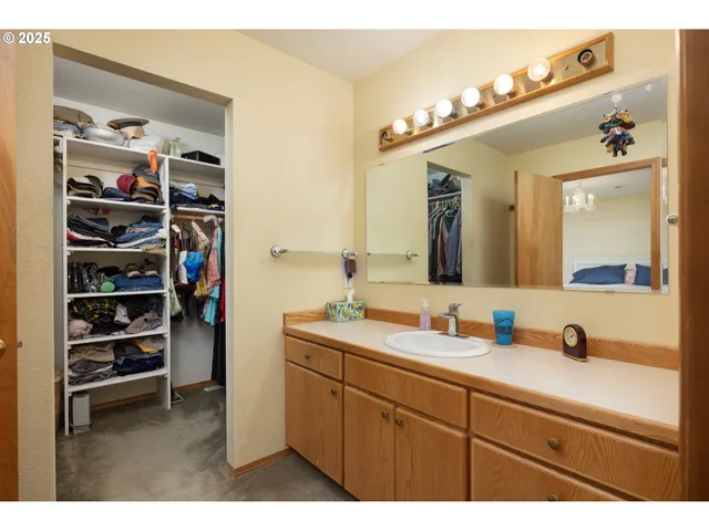 a bathroom with a sink a vanity and a mirror