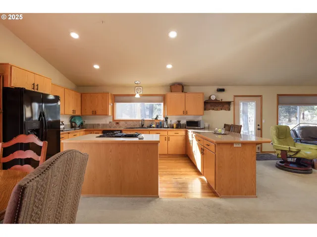 a kitchen with stainless steel appliances refrigerator stove microwave and stove