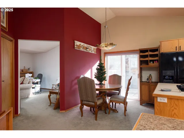 a dining room with furniture and a window