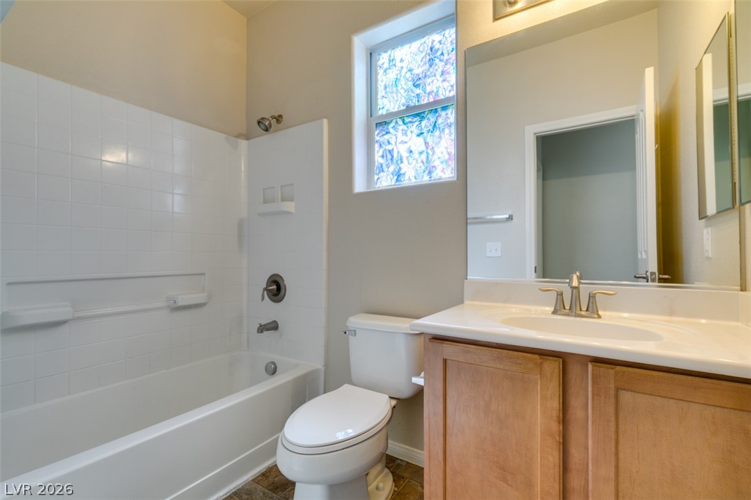 8937 Caledon Ridge Court Las Vegas, NV 89149 - Photo 31 of 43 A well-appointed bath features a combined shower and tub, complete with an elegant vanity.