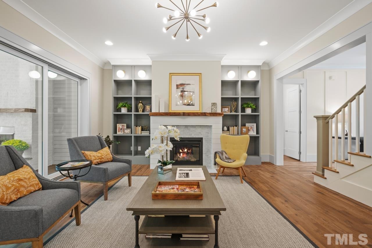 7204 Sing Along Court Raleigh, NC 27613 - Photo 15 of 46 a living room with furniture and a fireplace