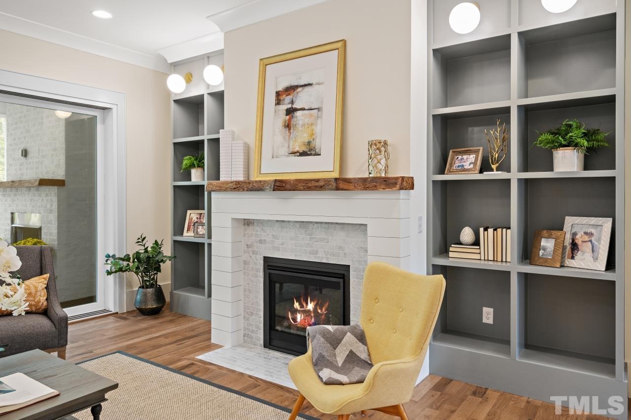 7204 Sing Along Court Raleigh, NC 27613 - Photo 16 of 46 a living room with furniture and a fireplace