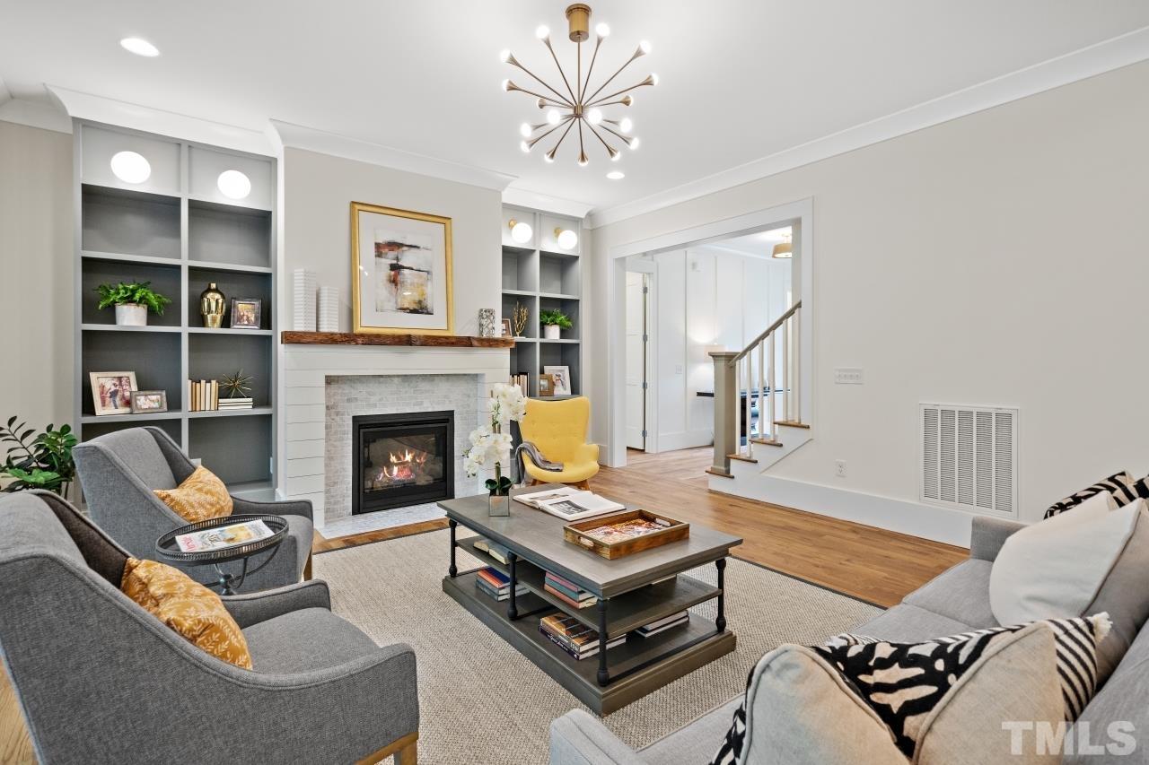7204 Sing Along Court Raleigh, NC 27613 - Photo 17 of 46 a living room with furniture and a fireplace