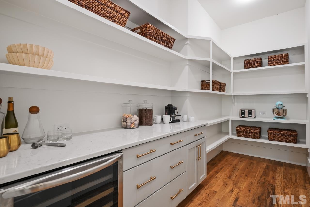 7204 Sing Along Court Raleigh, NC 27613 - Photo 21 of 46 a kitchen with cabinets and window