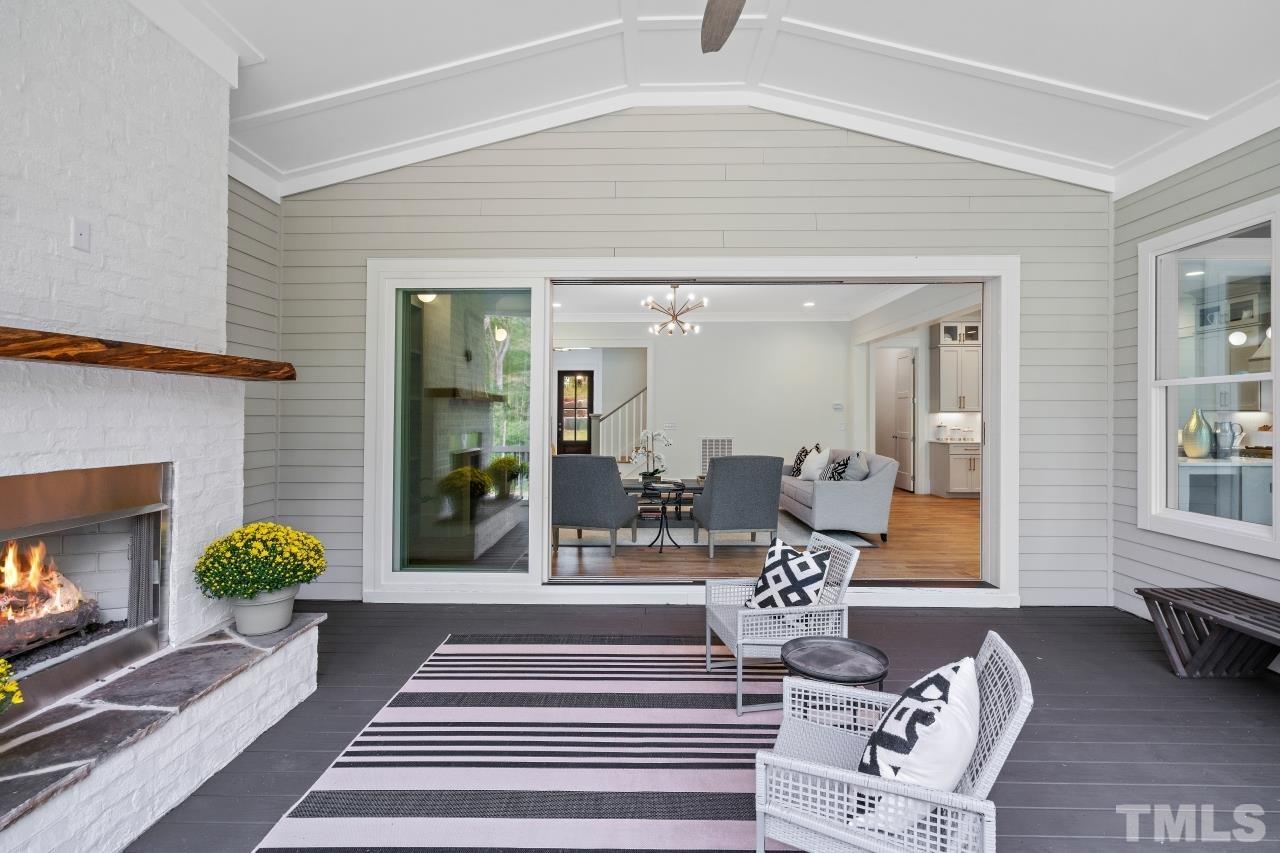 7204 Sing Along Court Raleigh, NC 27613 - Photo 24 of 46 a living room with furniture and a fireplace