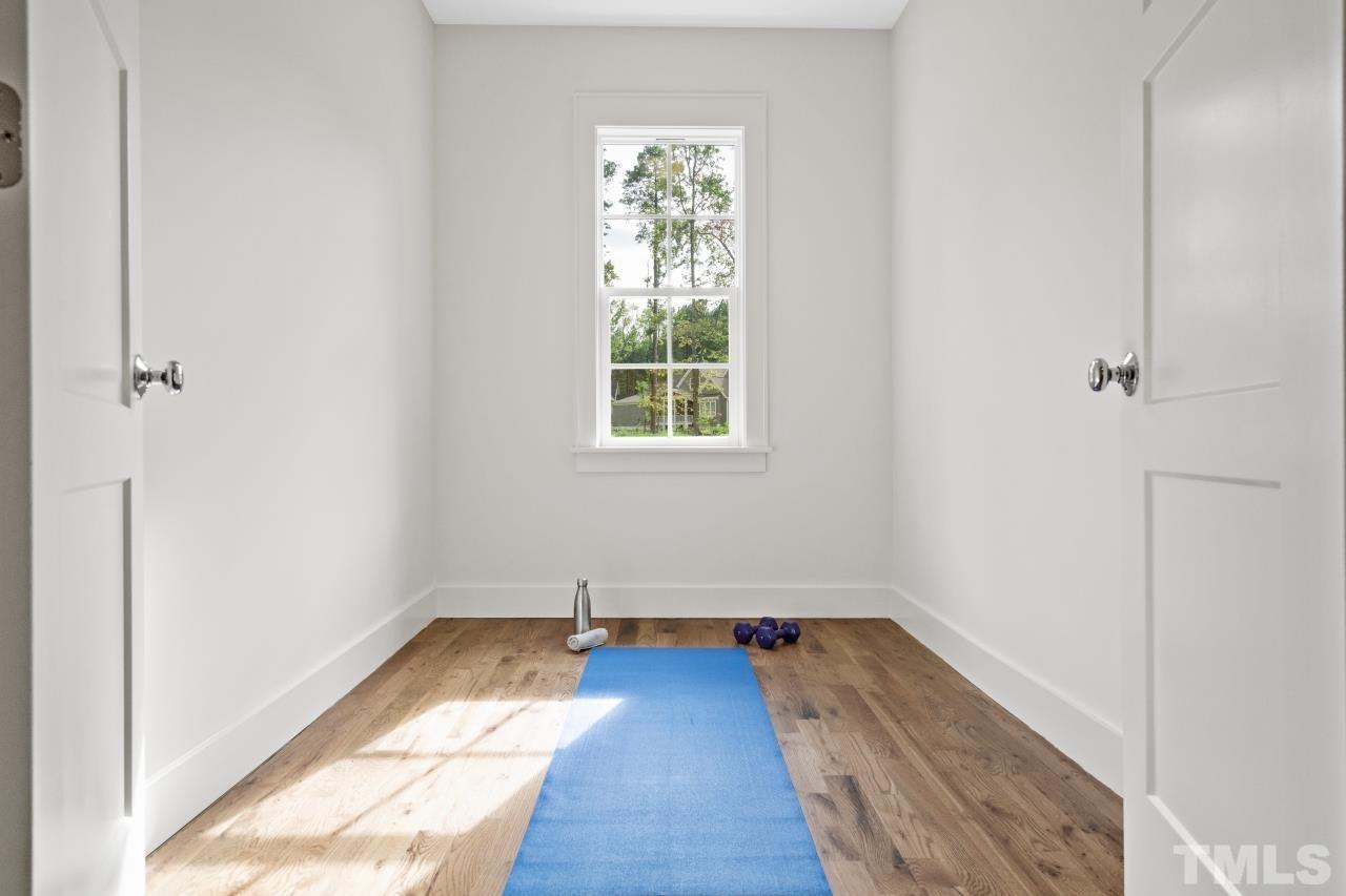 7204 Sing Along Court Raleigh, NC 27613 - Photo 33 of 46 a view of a room with wooden floor and window
