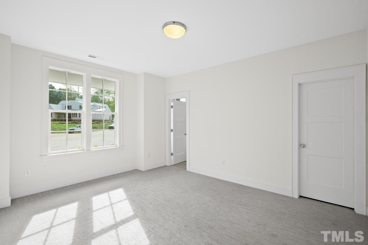 7204 Sing Along Court Raleigh, NC 27613 - Photo 34 of 46 a view of an empty room with a window