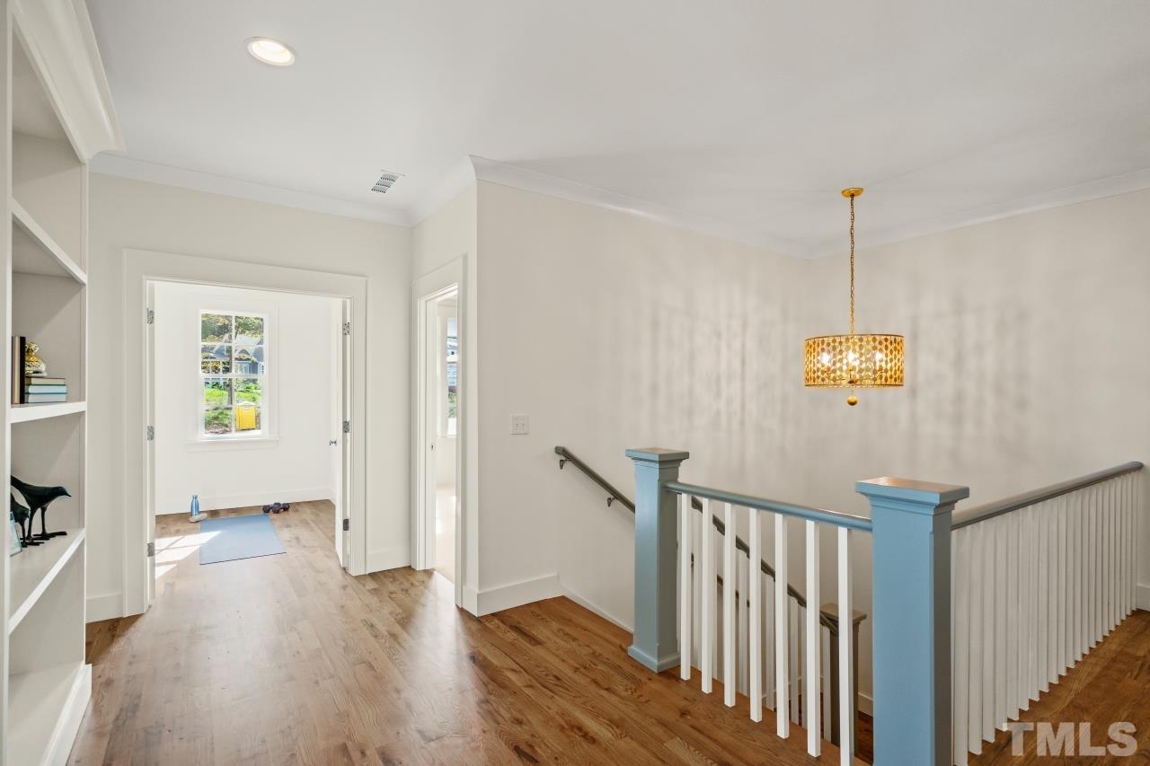 7204 Sing Along Court Raleigh, NC 27613 - Photo 36 of 46 a view of empty room with wooden floor and fan