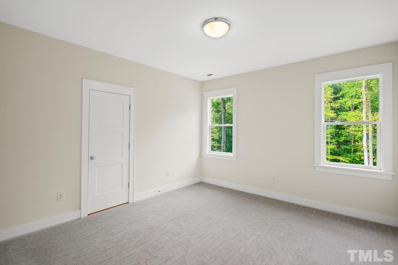 7204 Sing Along Court Raleigh, NC 27613 - Photo 44 of 46 an empty room with windows