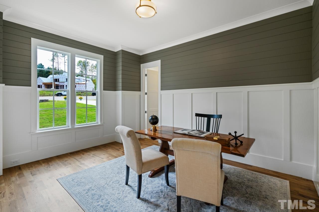 7204 Sing Along Court Raleigh, NC 27613 - Photo 5 of 46 a view of a livingroom with furniture and a table