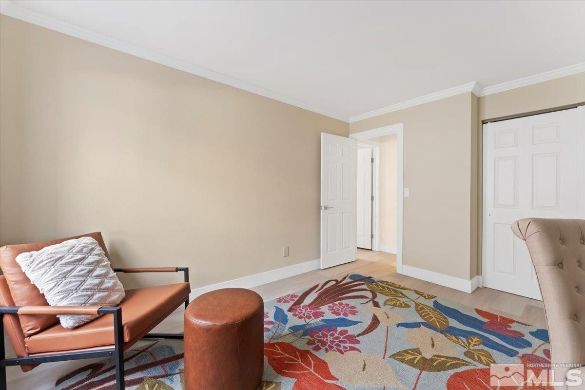 2380 Roundhouse Road Sparks, NV 89431 - Photo 16 of 22 a bedroom with a bed and chair