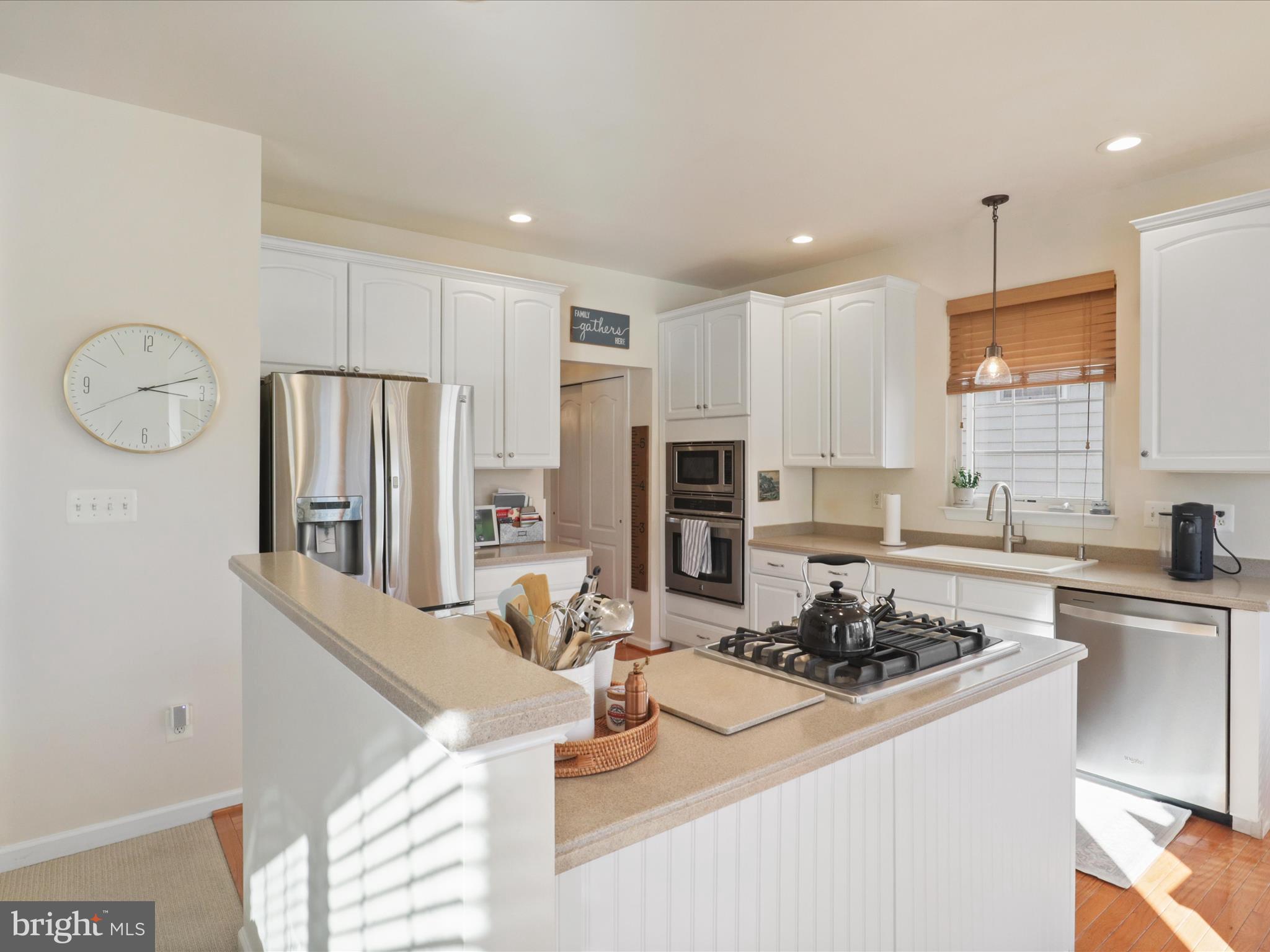 43081 Edgewater Street Chantilly, VA 20152 - Photo 16 of 50 a kitchen with stainless steel appliances granite countertop a sink stove and refrigerator