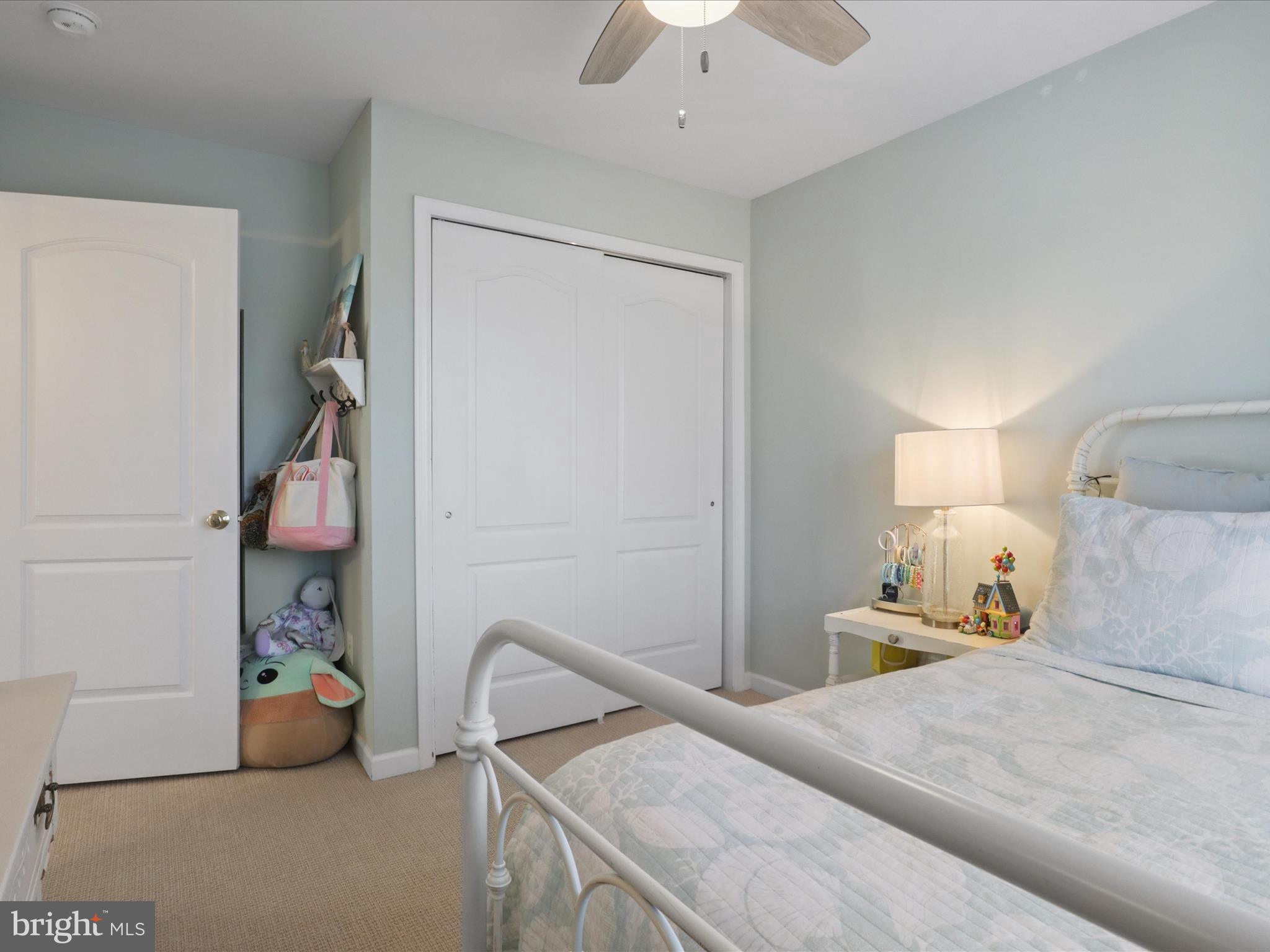 43081 Edgewater Street Chantilly, VA 20152 - Photo 22 of 50 a bedroom with a bed and a chandelier