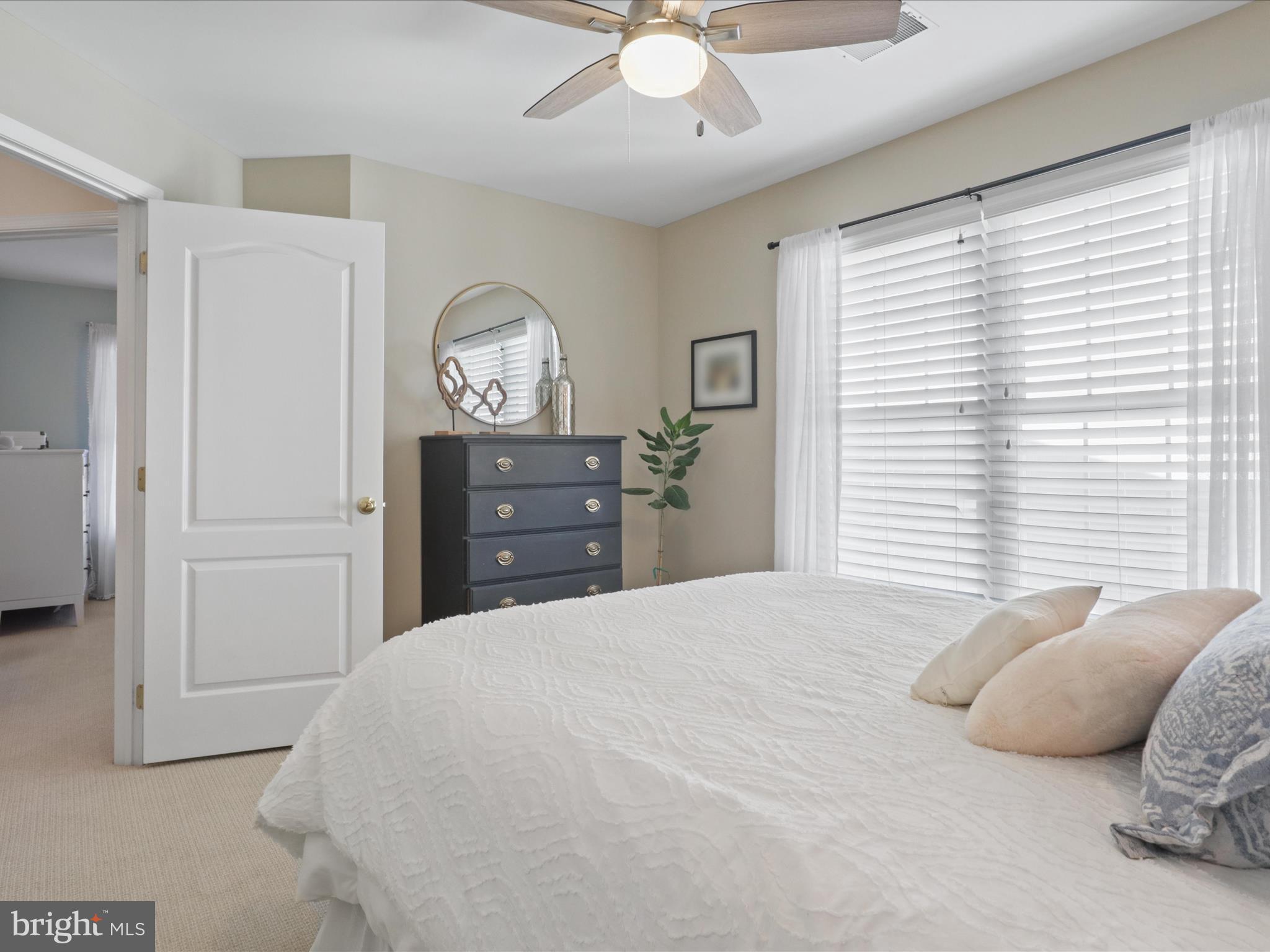 43081 Edgewater Street Chantilly, VA 20152 - Photo 26 of 50 a bedroom with a bed and a chandelier