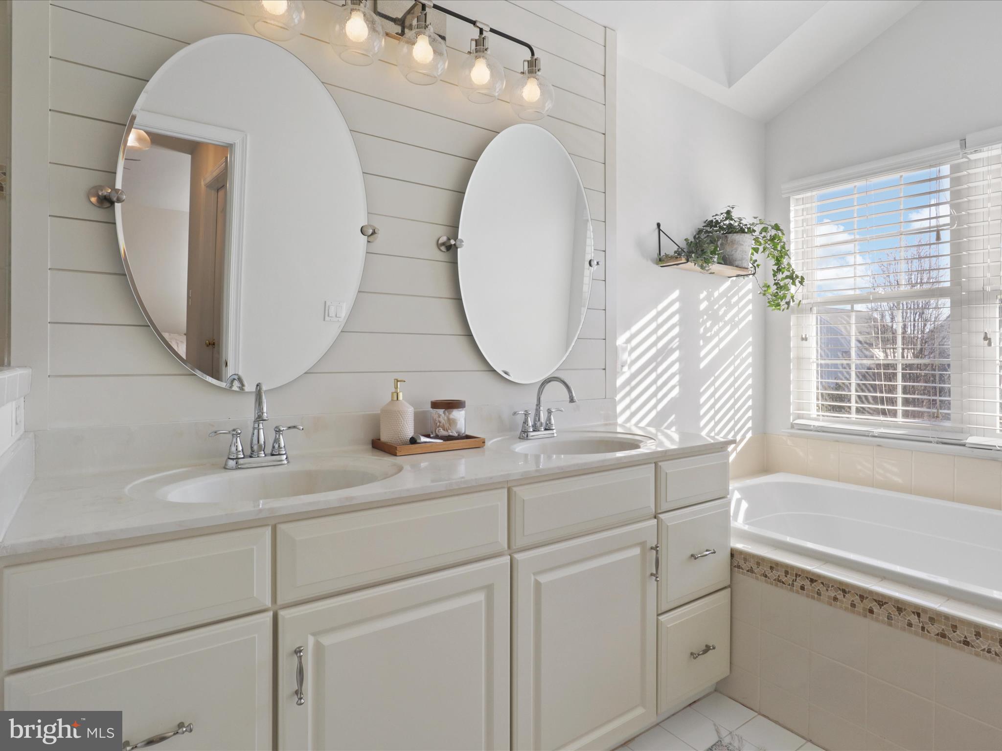 43081 Edgewater Street Chantilly, VA 20152 - Photo 30 of 50 a bathroom with a double vanity sink and a mirror
