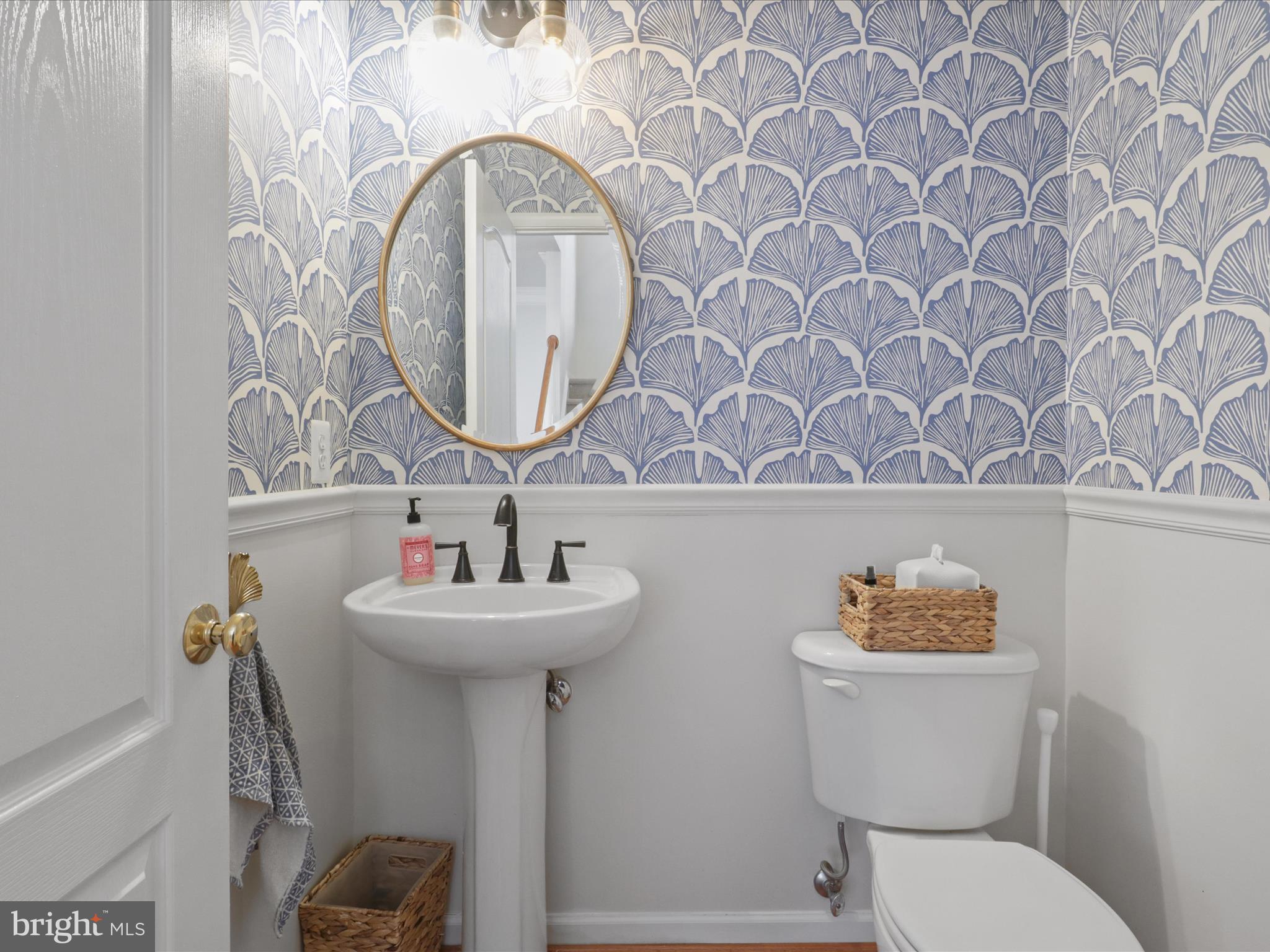 43081 Edgewater Street Chantilly, VA 20152 - Photo 9 of 50 a bathroom with a toilet sink and mirror
