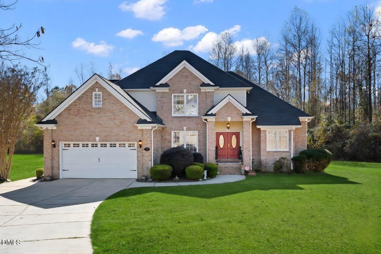 226 Marshview Circle Angier, NC 27501 - Photo 17 of 20 a view of a house with a yard and potted plants