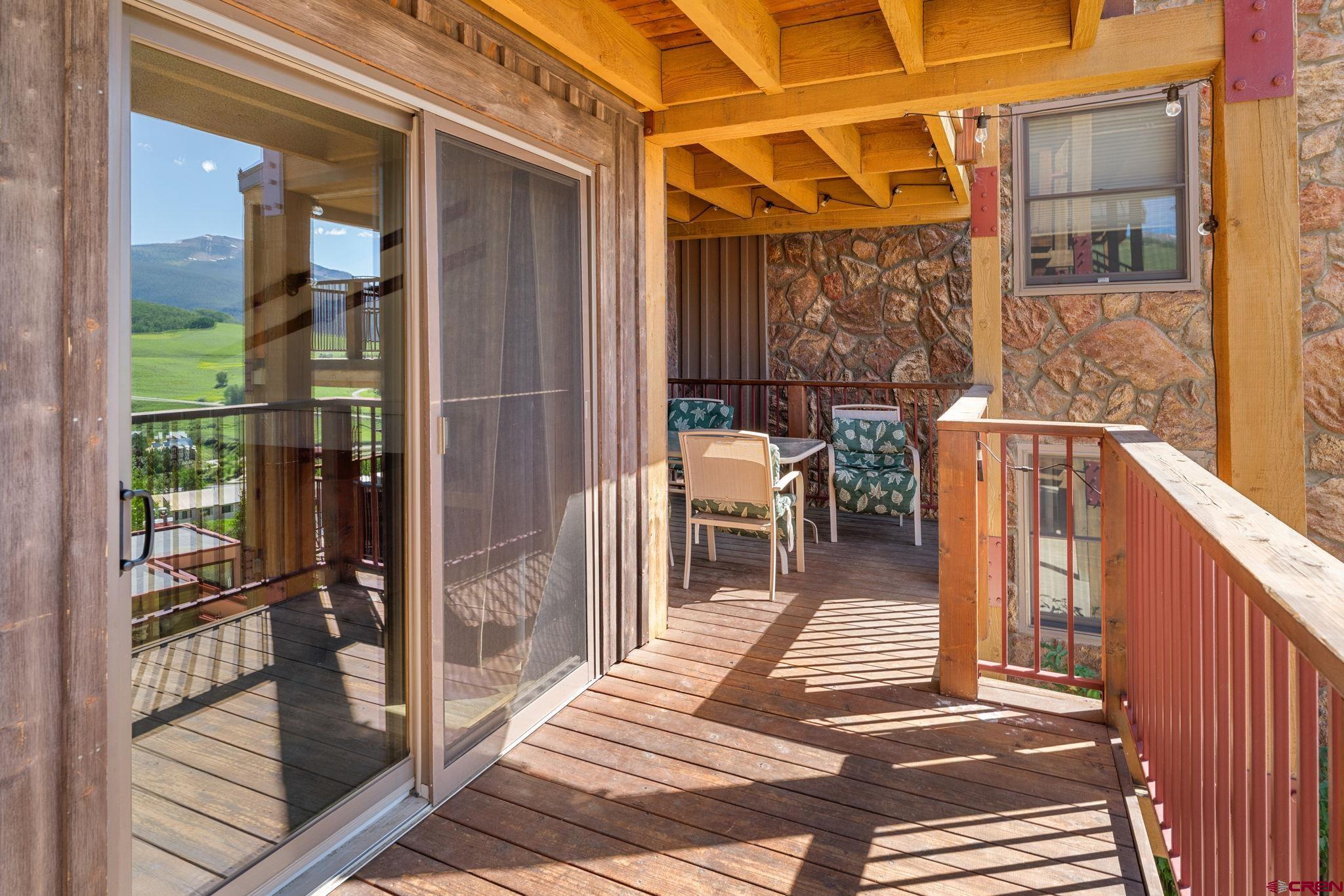 72 Hunter Hill Road, Unit I204 Crested Butte, CO 81225 - Photo 32 of 44 a balcony view with a glass door
