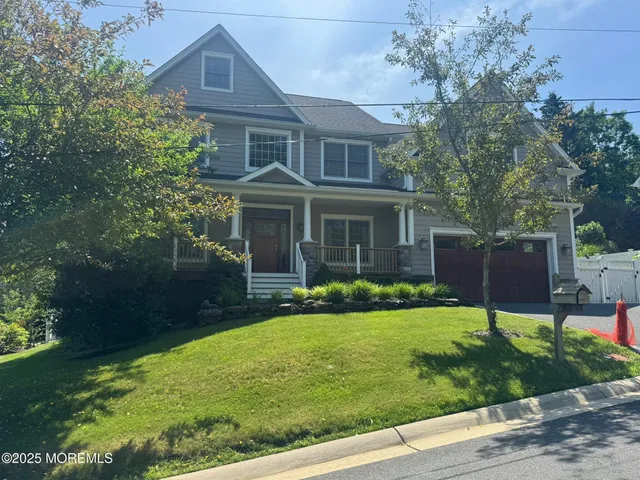 a view of a house with a yard and plants