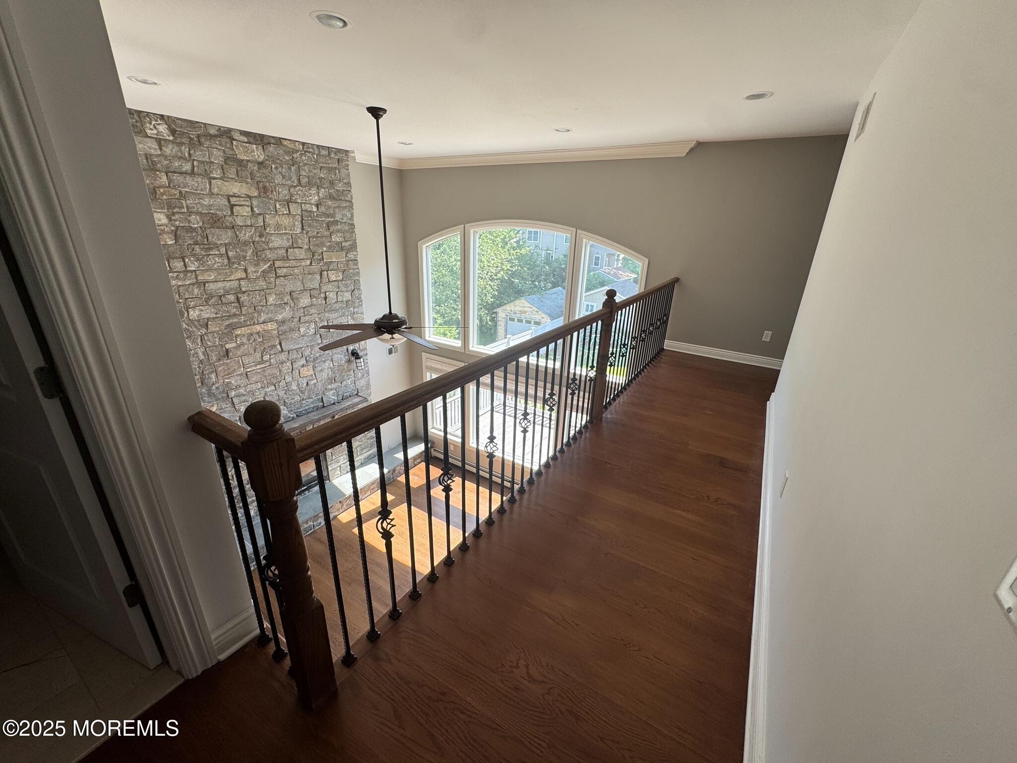 244 Van Kirk Avenue Atlantic Highlands, NJ 07716 - Photo 11 of 22 a view of a hallway with wooden floor and stairs