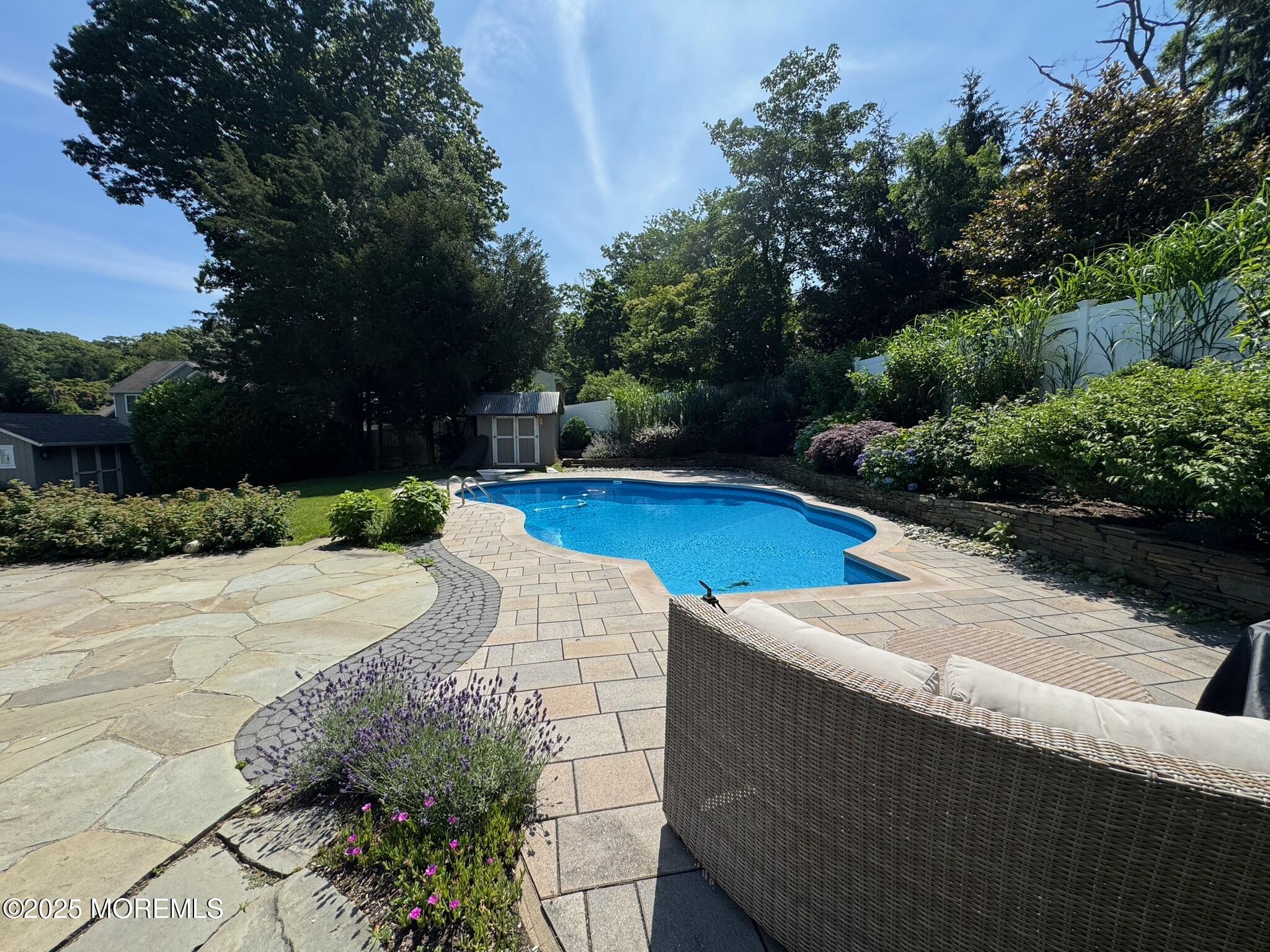 244 Van Kirk Avenue Atlantic Highlands, NJ 07716 - Photo 17 of 22 a view of a swimming pool with an outdoor space and seating area