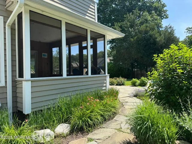 a view of a house with sitting area and garden