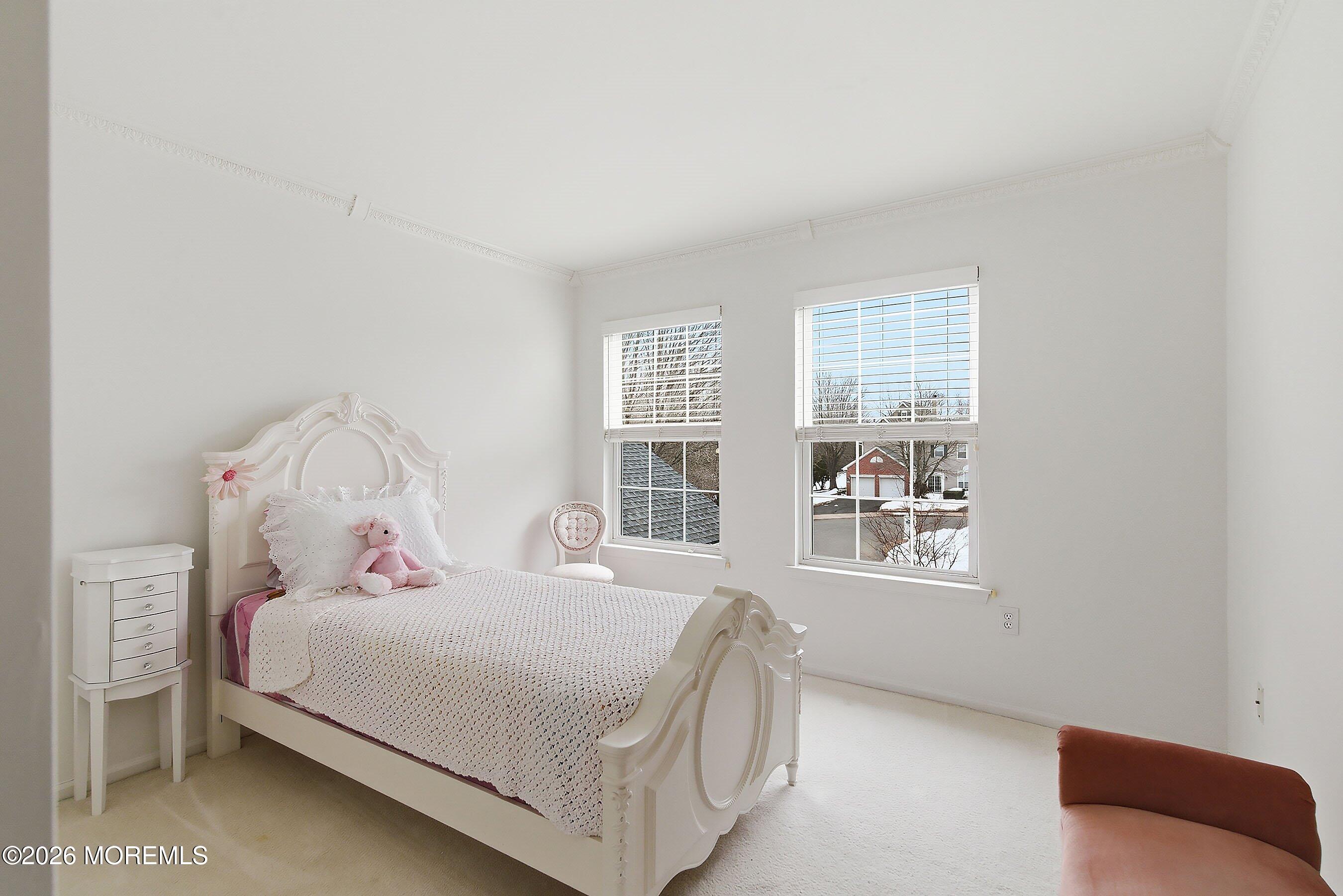 2409 Robin Way Manasquan, NJ 08736 - Photo 20 of 40 a bedroom with a bed and a window