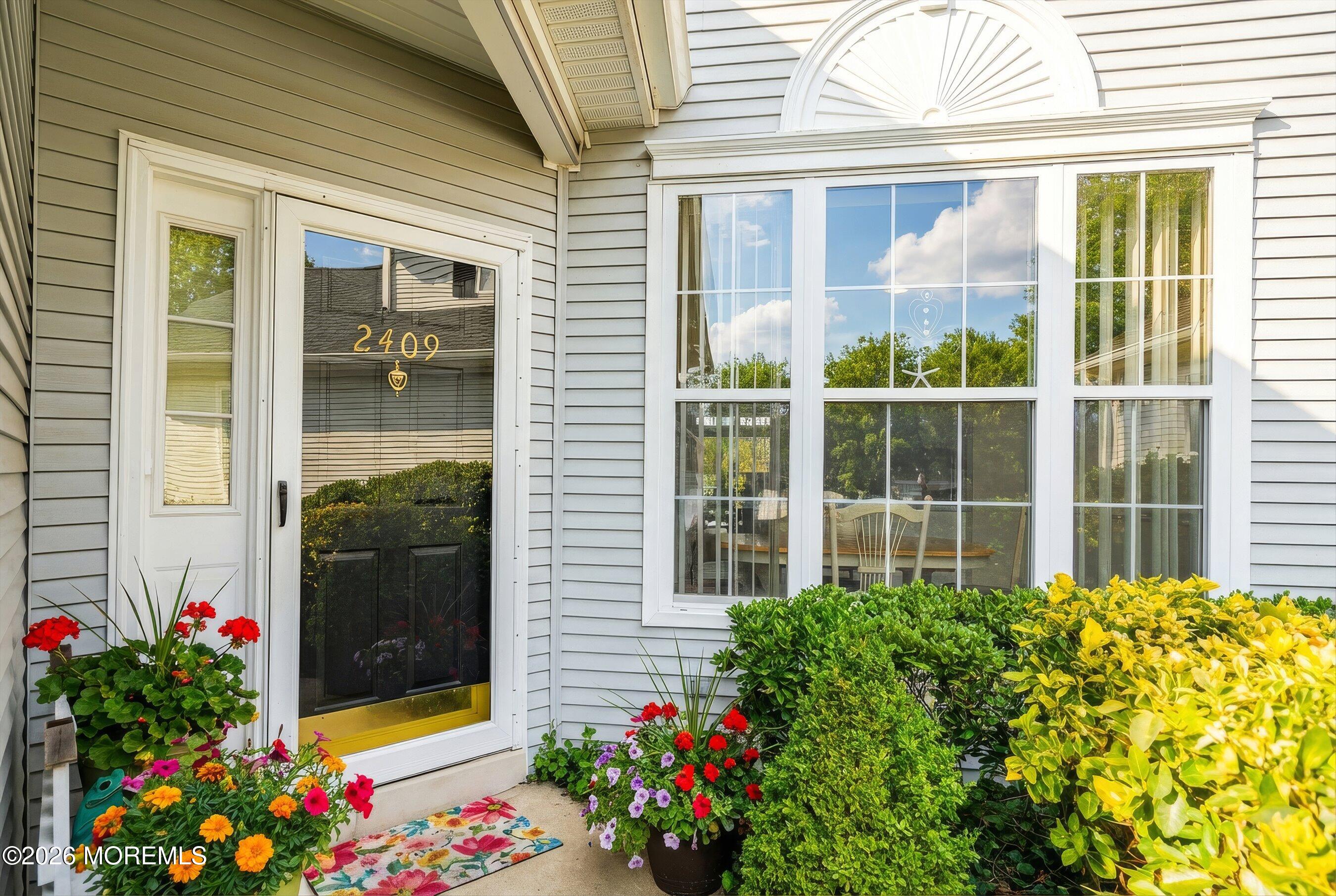 2409 Robin Way Manasquan, NJ 08736 - Photo 3 of 40 a flower plants in front of a house
