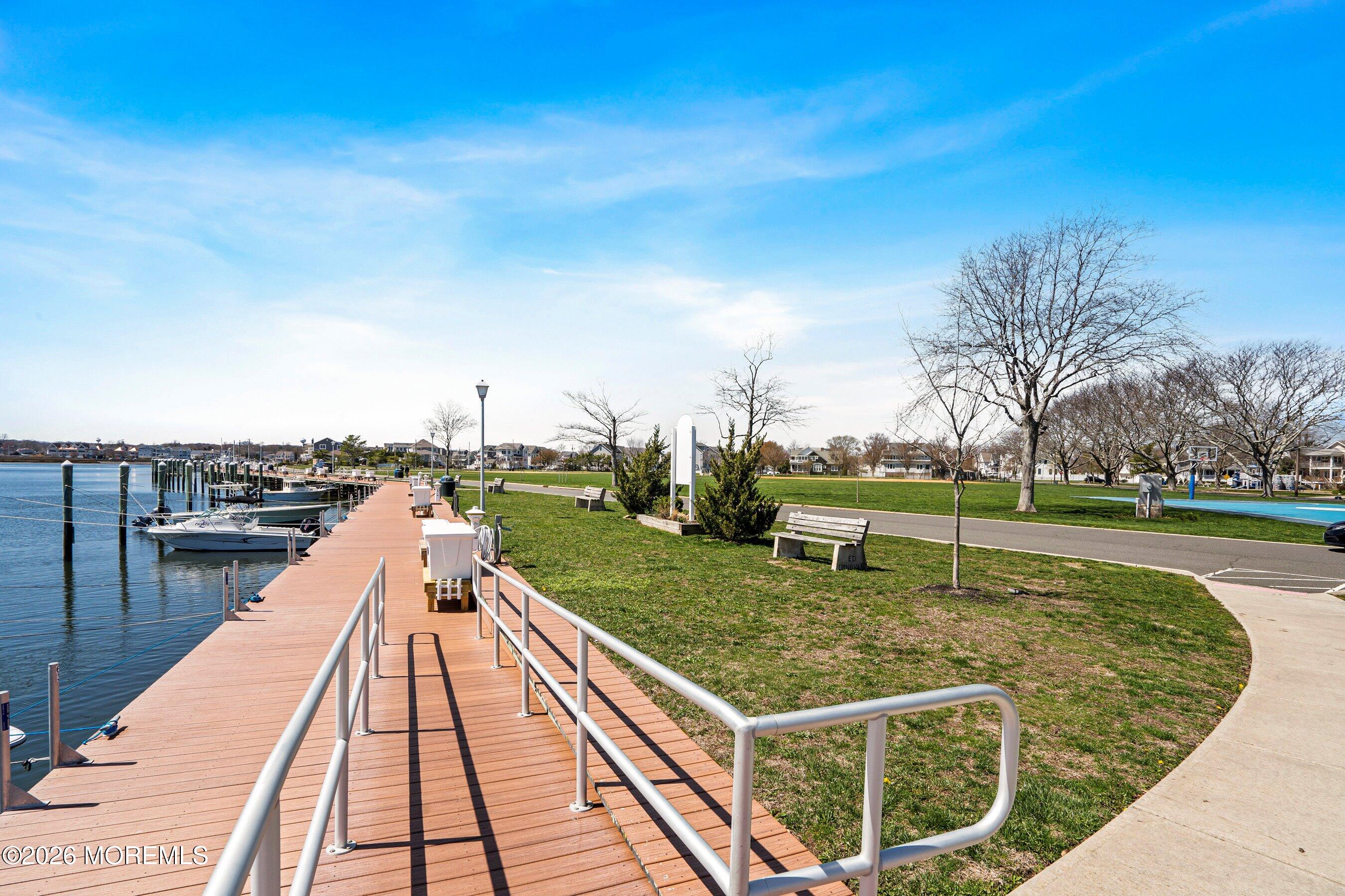 2409 Robin Way Manasquan, NJ 08736 - Photo 31 of 40 a view of a swimming pool with a lake view