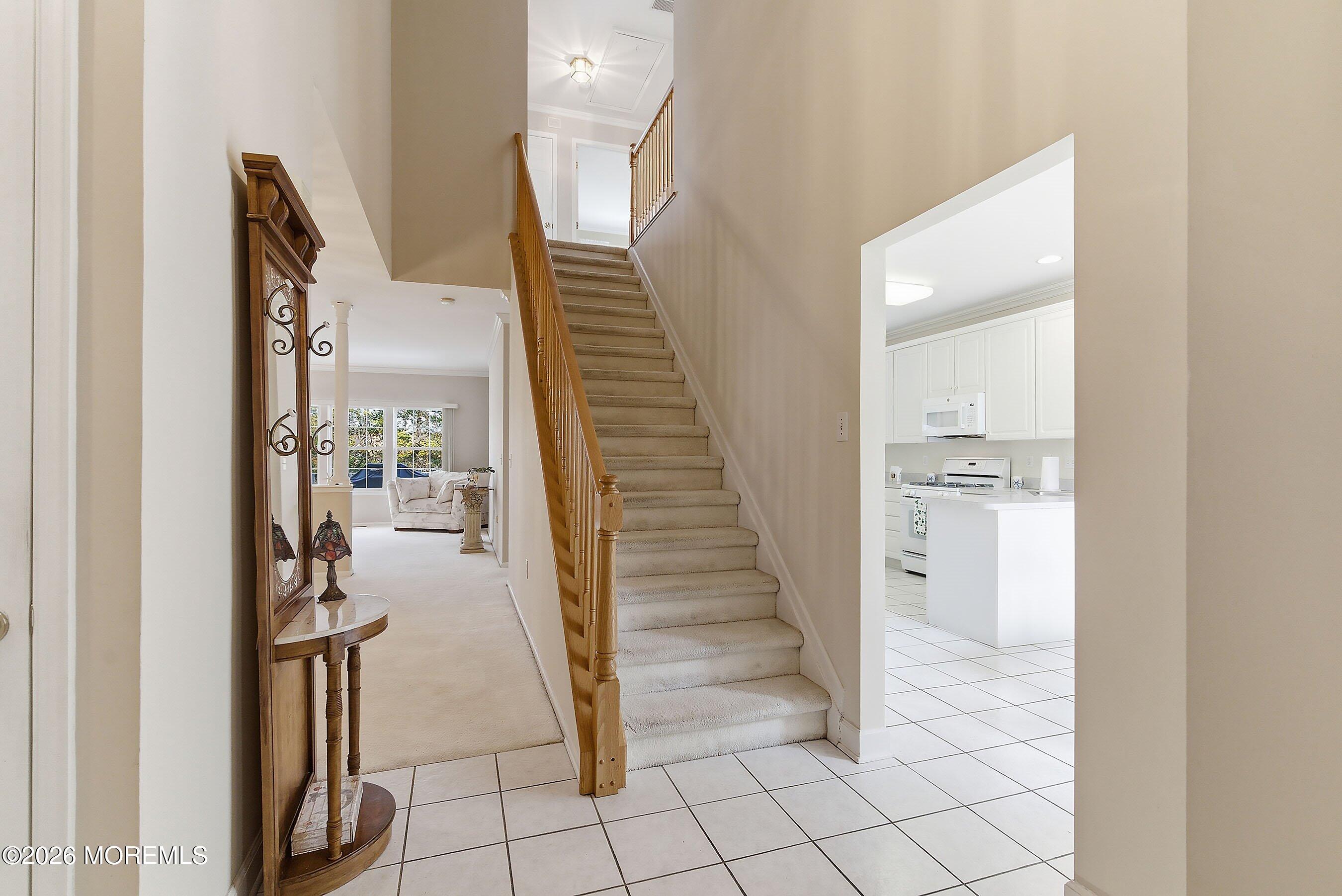 2409 Robin Way Manasquan, NJ 08736 - Photo 4 of 40 a view of a hallway with staircase