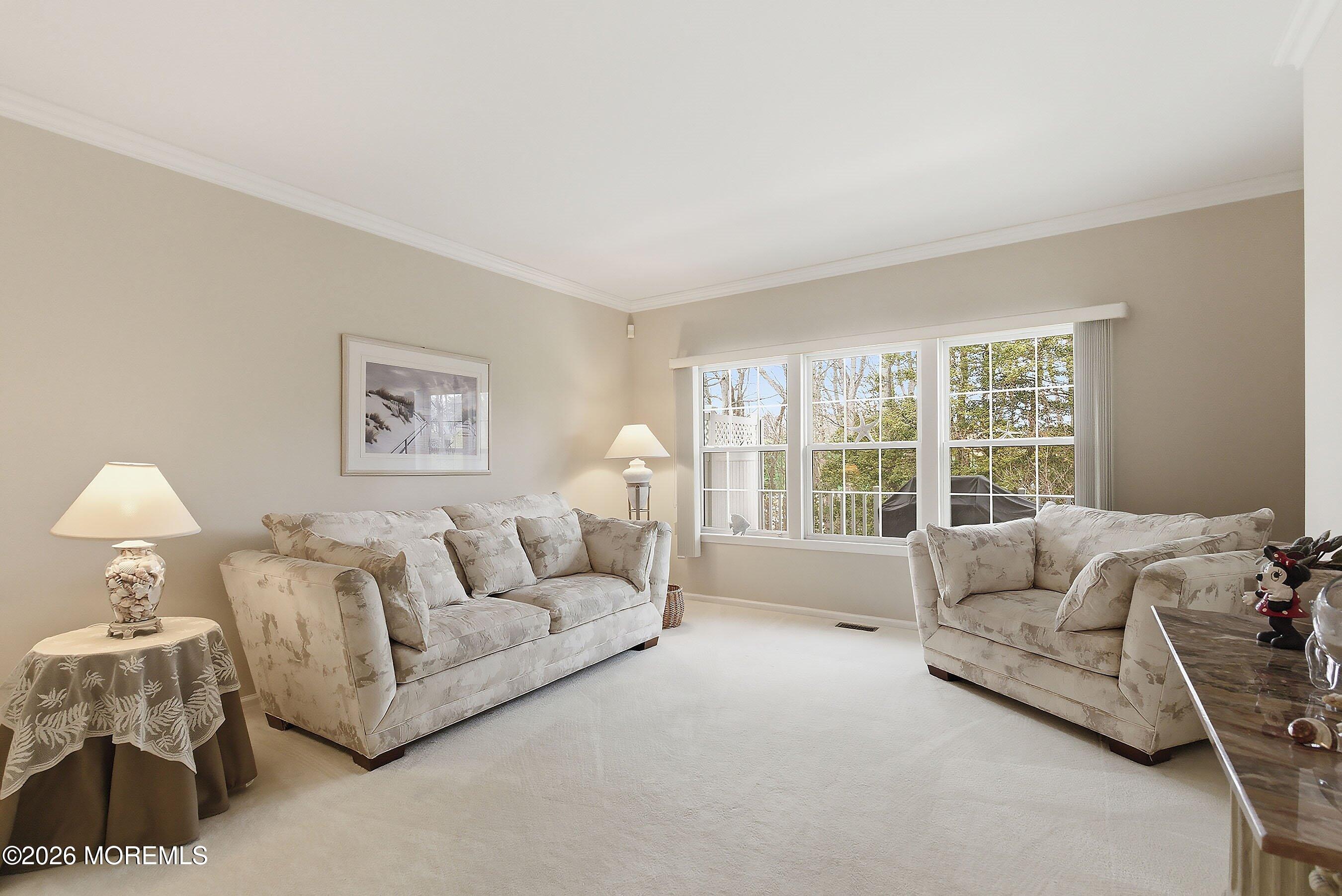 2409 Robin Way Manasquan, NJ 08736 - Photo 10 of 40 a living room with furniture and a large window